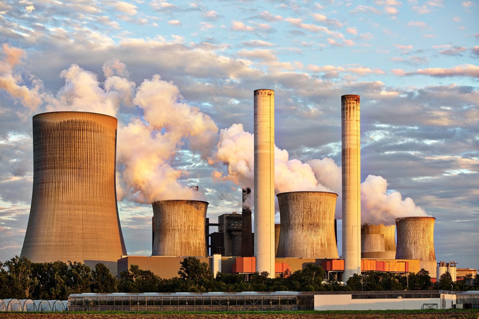 Smoke billowing from a factory, causing air pollution.