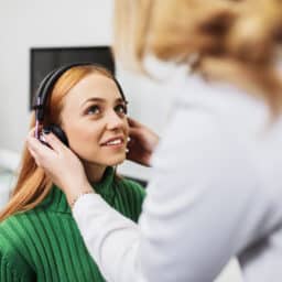 Woman participates in hearing test