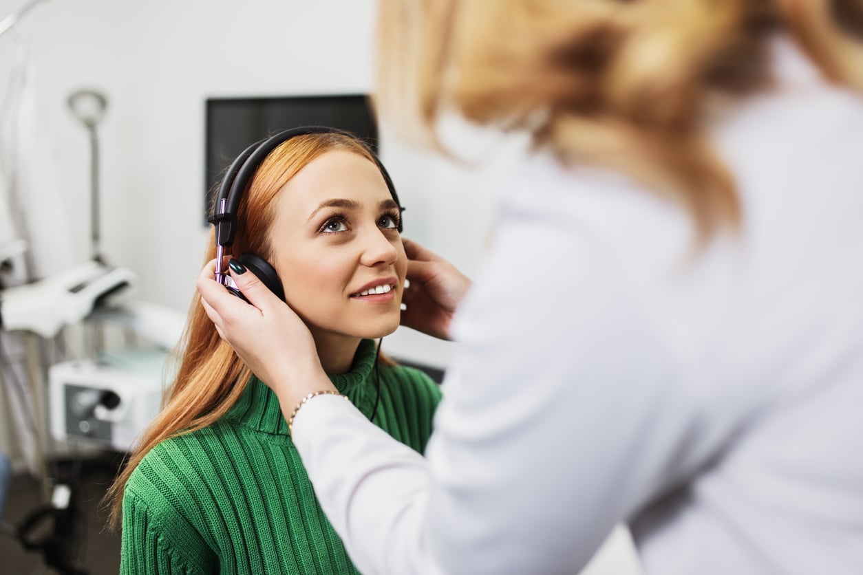 Woman participates in hearing test
