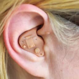 Close-up of a hearing aid in someone's ear